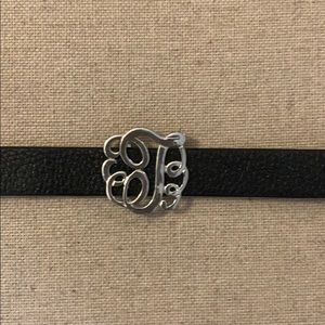 Black leather upper bracelet with letter T